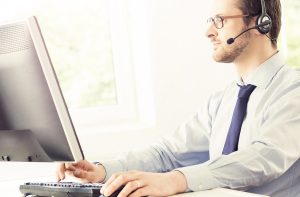 Operator at work in a call center. Hot line office worker concep